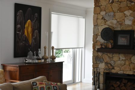 Roller Blinds in a living room with a fireplace