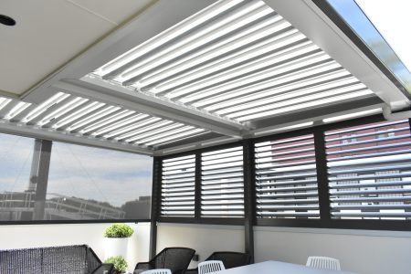 Roof and window shutters in an outdoor seating area