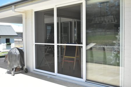 Flyscreens over a sliding door