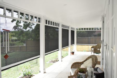 Sunscreen blinds on a small front patio