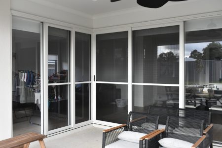 Flyscreens behind sliding doors