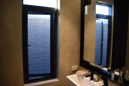 Flyscreen in front of a bathroom window